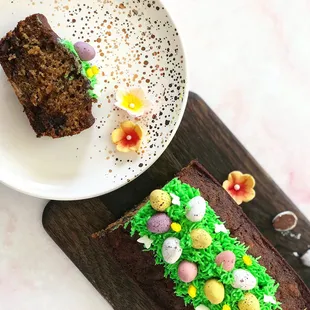 a slice of chocolate cake and a plate of easter eggs