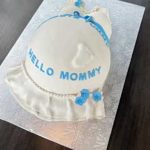 Baby shower cake for a mommy to be .