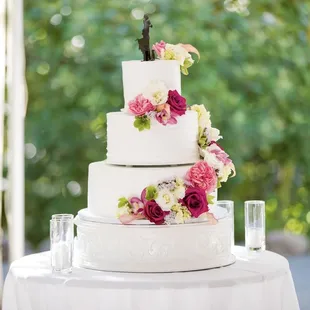 Three-tier wedding cake with strawberry cream, red velvet, and white cream