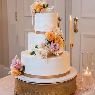 Cake Flavors: white chocolate raspberry 1st tier, vanilla cake with fresh strawberries 2nd tier, and red velvet 3rd tier