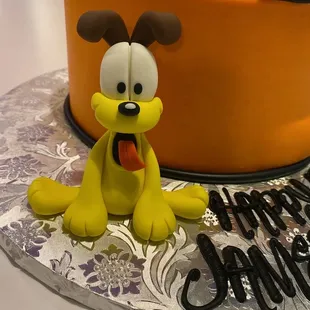 a cake with a dog on it