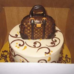 Lemon cake with a replica Louis Vuitton handbag...structurally made of rice crispy treat. :)