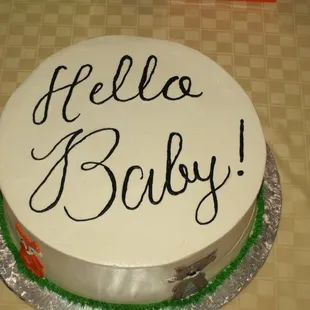 a cake with a hello baby written on it