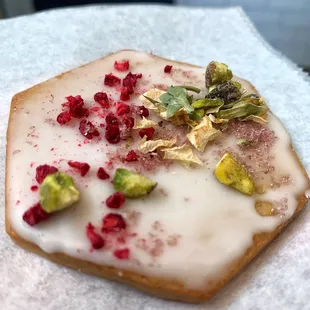 a pastry with icing and toppings