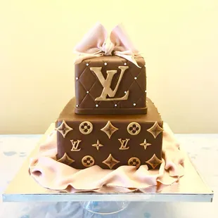 An LV theme cake , everything handcrafted and all edible.