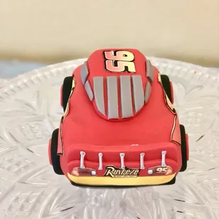 An edible lightning McQueen cake topper handcrafted with love for a little fan