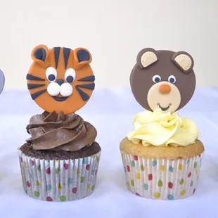 Vanilla cup cake with swiss vanilla buttercream . Choc cup cake with chocolate fudge icing . Edible fondant toppers.