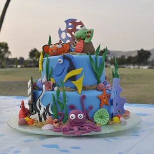 All the figures are edible and made from high quality fondant . Inside cake is super moist chocolate cake filled with ganache .