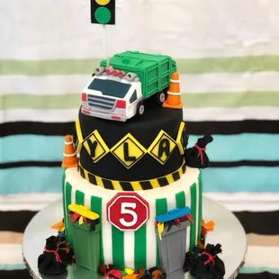 Garbage truck theme cake .. everything on the cake is edible and both tiers have different flavors .