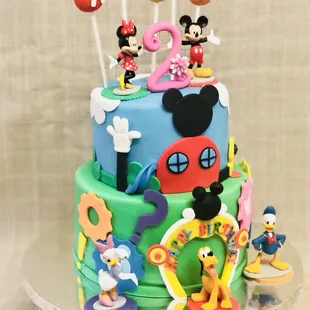 Mickey Mouse club house cake for a little fan .