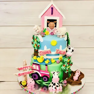 A barnyard theme cake for little twin girls :)All figures are edible n handcrafted .
