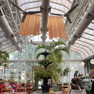 a dining area with a fountain in the center