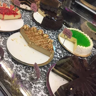 a variety of cakes on display