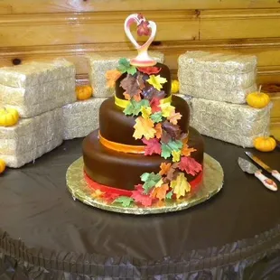 a chocolate cake decorated with fall leaves