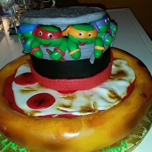 a pizza with teenage mutant turtles on top