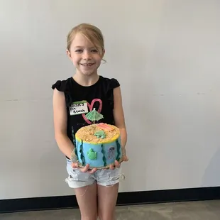 Showing off her cake!