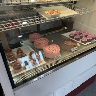 a display of cakes and pastries
