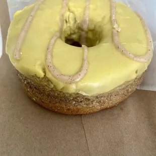 a glazed donut with yellow icing
