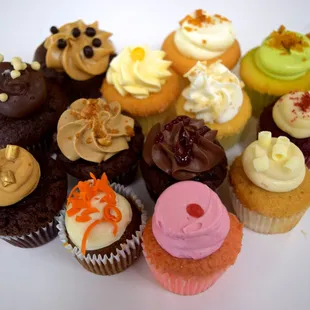 Daily mini cupcakes: caramel decadence, mocha macadamia, strawberry guava, pistachio, lemon lilikoi, devil&apos;s food, carrot cake, red velvet