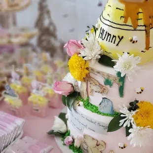 a cake with a bee and flowers on top
