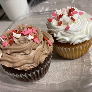 two cupcakes with frosting and sprinkles