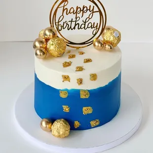 a blue and white birthday cake