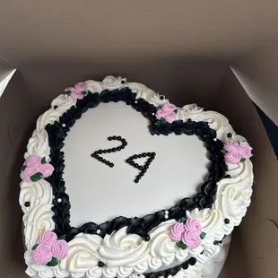 a heart shaped cake in a box