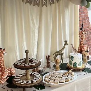 Our theme was giraffes and I added the cake topper. The cake was everything I envisioned!