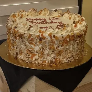Italian wedding cake created as a birthday cake. Shaved almond and apricot, pure perfection.