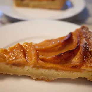 Peach tart - peach compote on almond cream in an almond short crust.