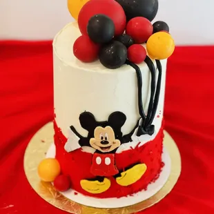 Mickey with balloons 
Everything edible 
6 inch 4 layer 
4 layers of chocolate with 3 layers of chocolate custard n Nutella ganache