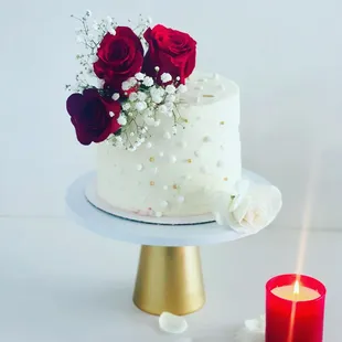Anniversary cake 
Real flowers 
Red velvet cake