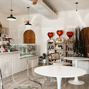 a table and chairs in a bakery