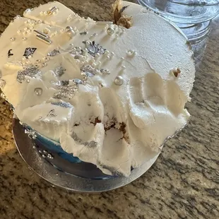 a cake with white frosting