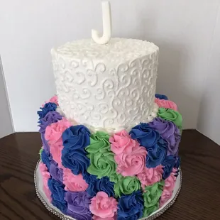 Colorful rosette cake with free handed piping