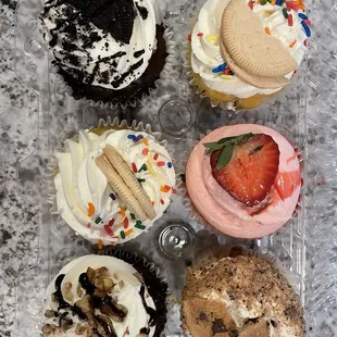 Left: Turtle Cupcake, Birthday Cake Cupcake and Oreo Cupcake  Right: Cookie Dough Cupcake, Strawberry Cupcake and Birthday Cake