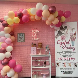 Backdrop area with balloons and signage