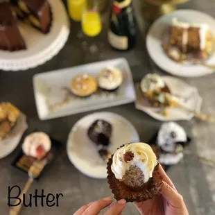 a person holding a piece of cake