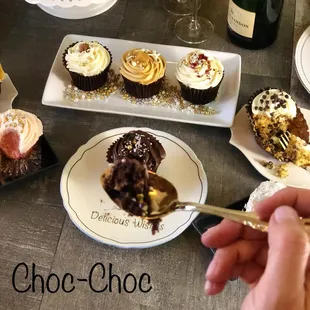 a chocolate cupcake on a plate with a fork