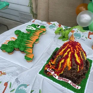 Dinosaur and volcano shape cakes