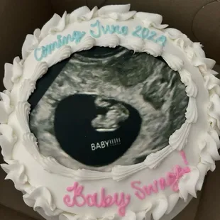 Custom image transferred to a cake for a baby announcement