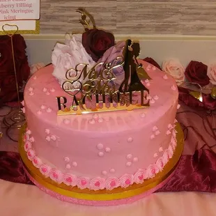 10" round anniversary cake with synthetic roses.