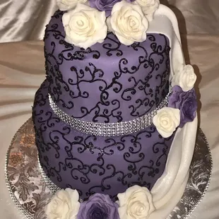 2 Tier purple &amp; black fondant wedding cake and roses