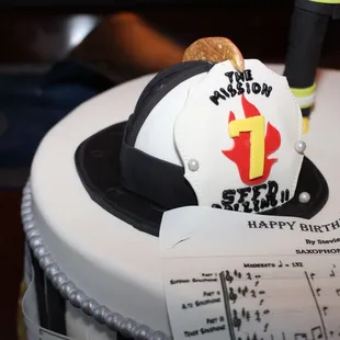 a cake with a fireman on top