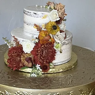 Wedding cake decorated with fresh flowers