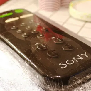 Whimsical cake: Saran-wrapped Remote Control cake