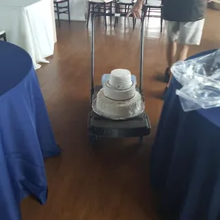 wedding cake assembled on cart