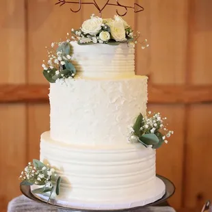 a wedding cake with white flowers