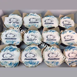 a box of decorated cupcakes