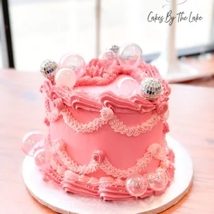 a pink cake on a plate